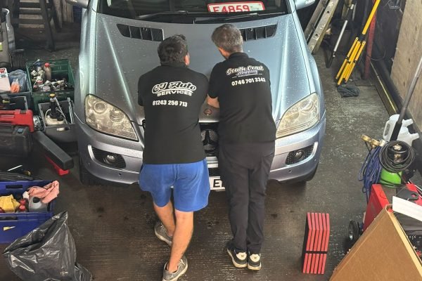 CJ Auto Services team working on a vehicle